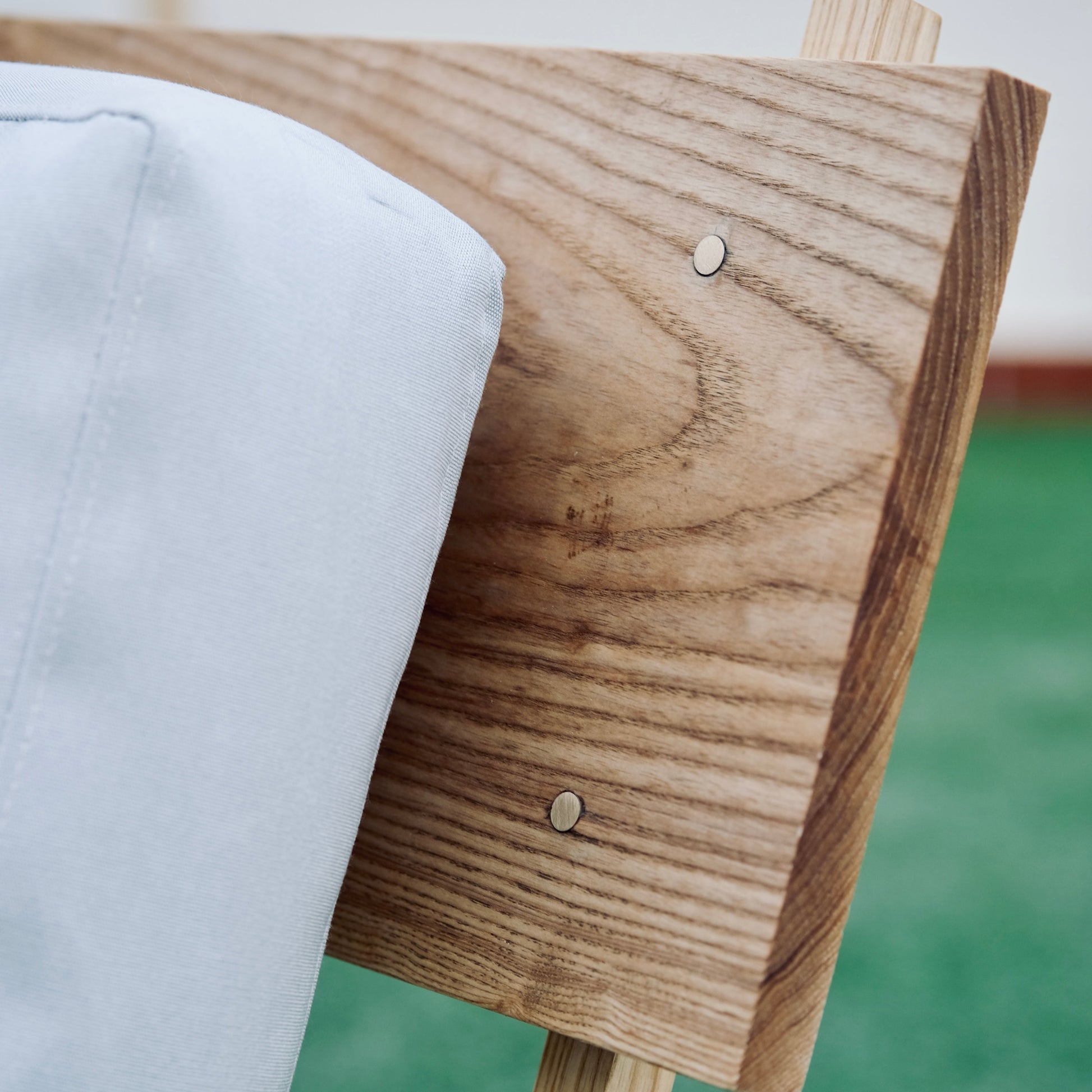 Wooden chair with white cushion