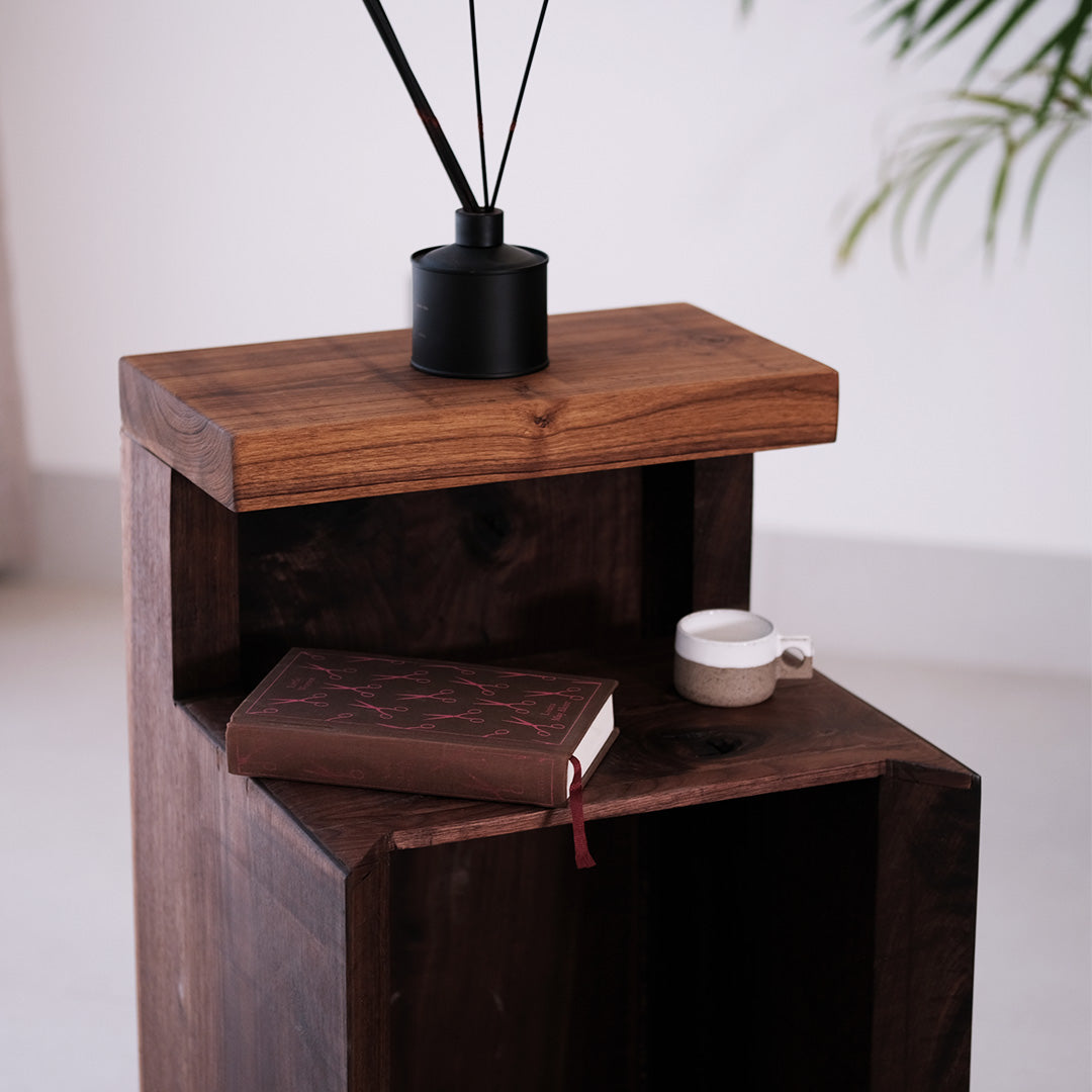 Walnut and teak DuoRest Side Table with sturdy frame and drawer, offering style and utility.