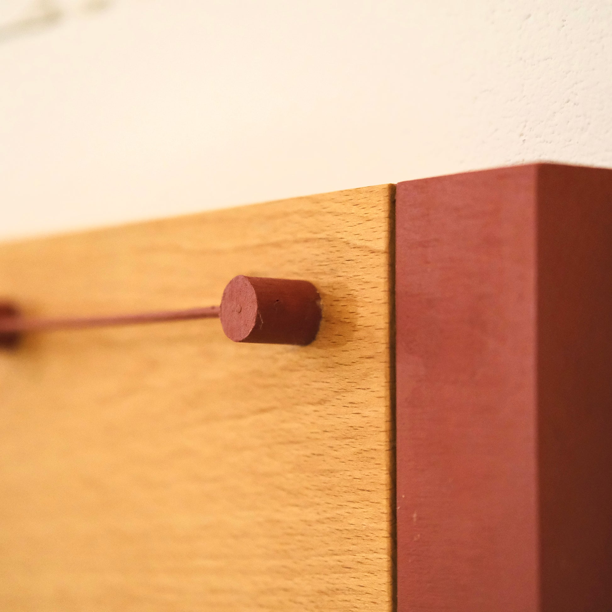 Wall-mounted sunglasses holder in premium wood with minimalist design for stylish organization